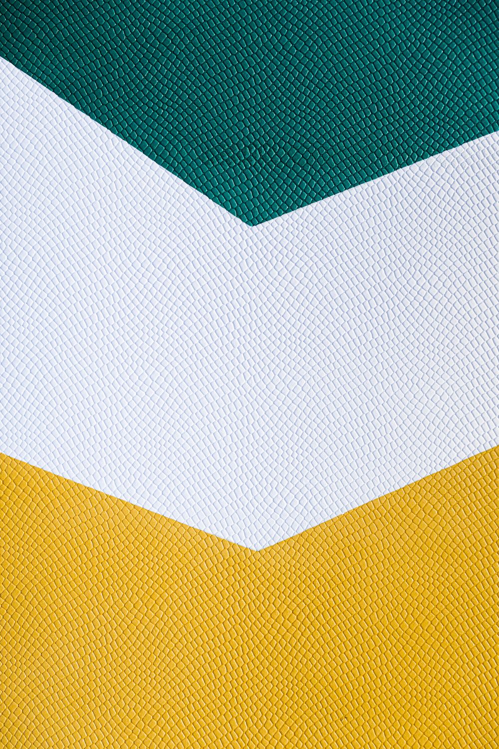 a close up of a green, white and yellow fabric