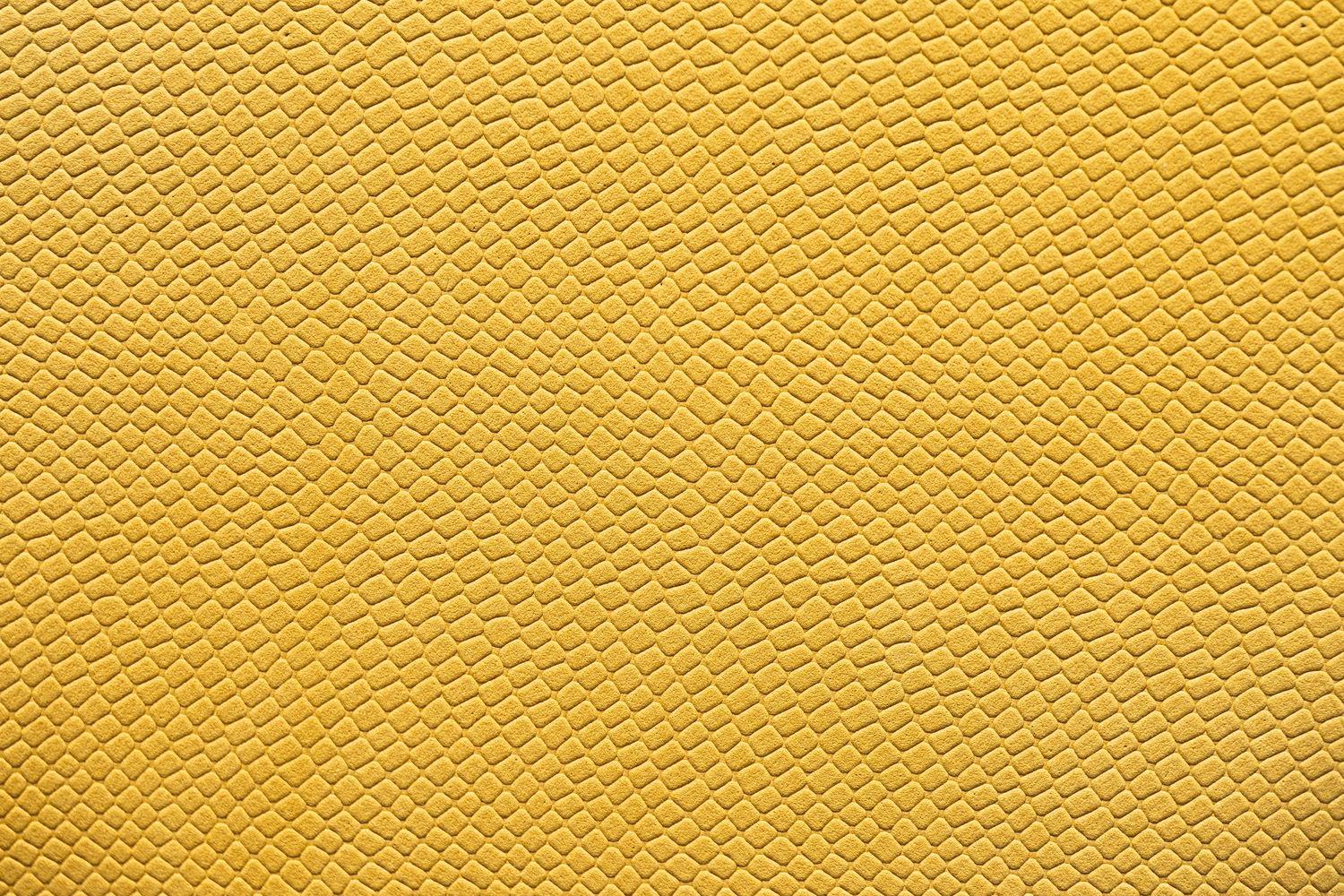 a close up of a yellow textured background