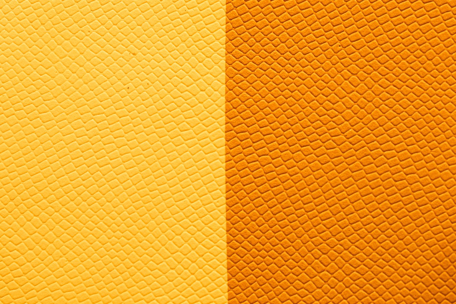 a close up of a yellow and orange leather texture