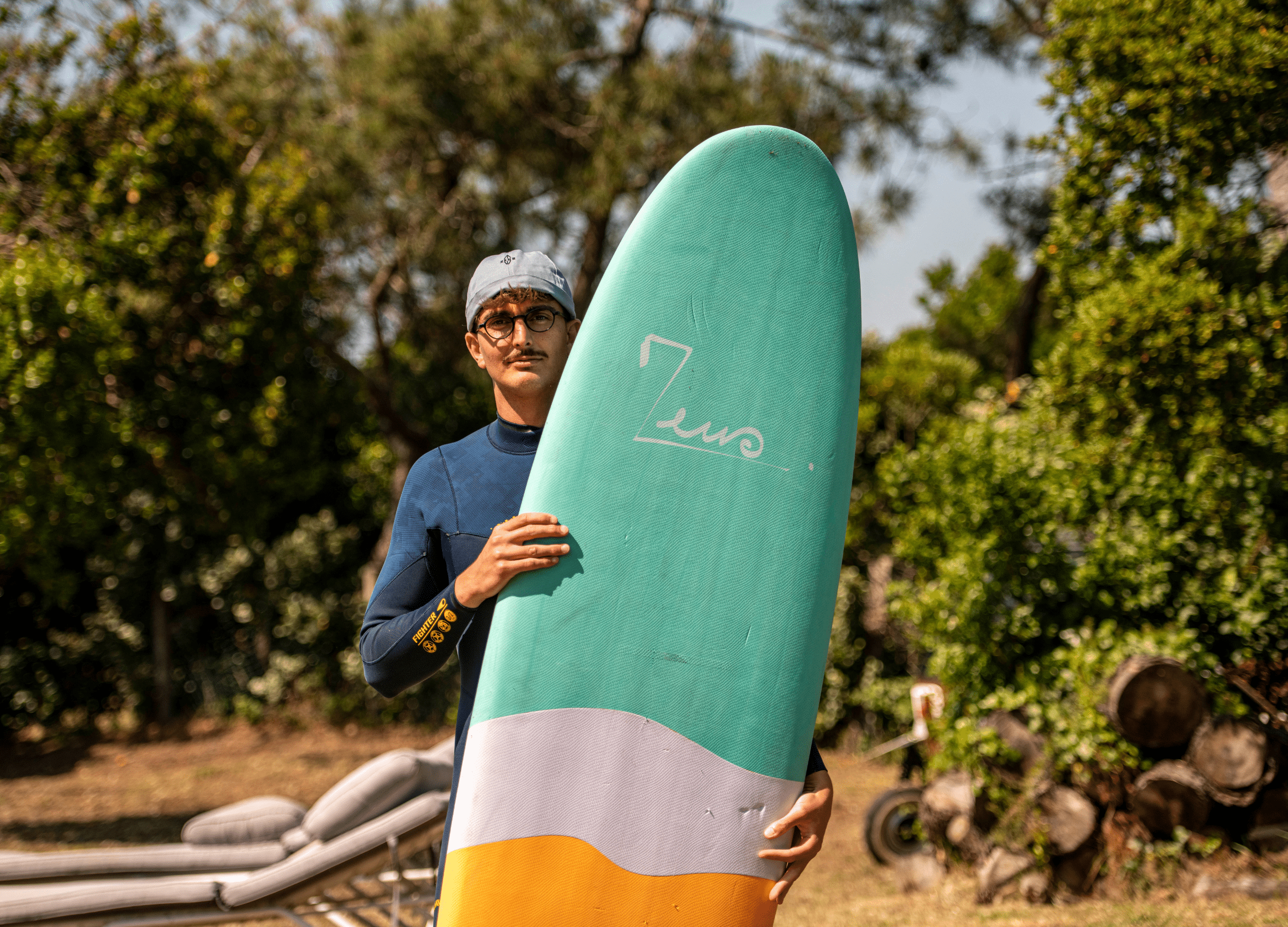 a man holding a surfboard in his hands