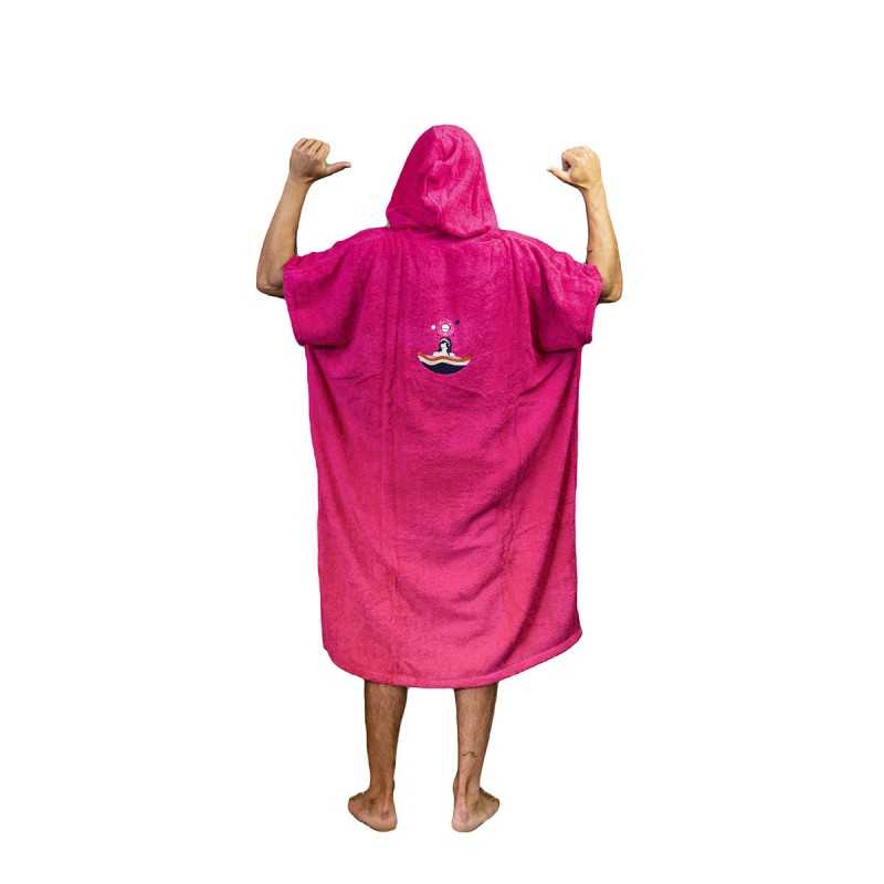 a man in a pink robe is standing with his arms in the air